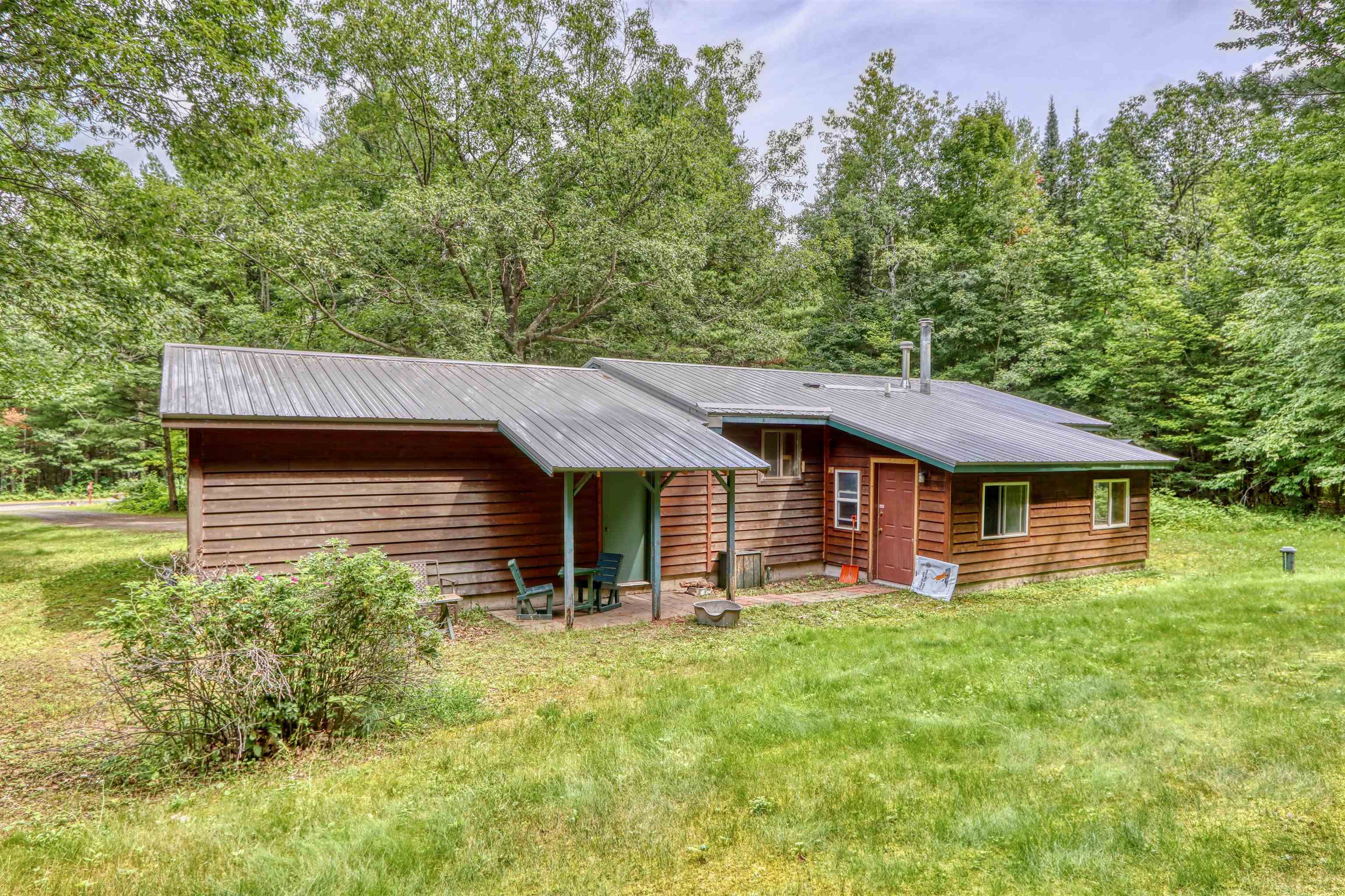 22655 Sunset Acres Lane Grand View, WI 54839 - Photo 37 of 47 Back of property with a yard and a metal roof