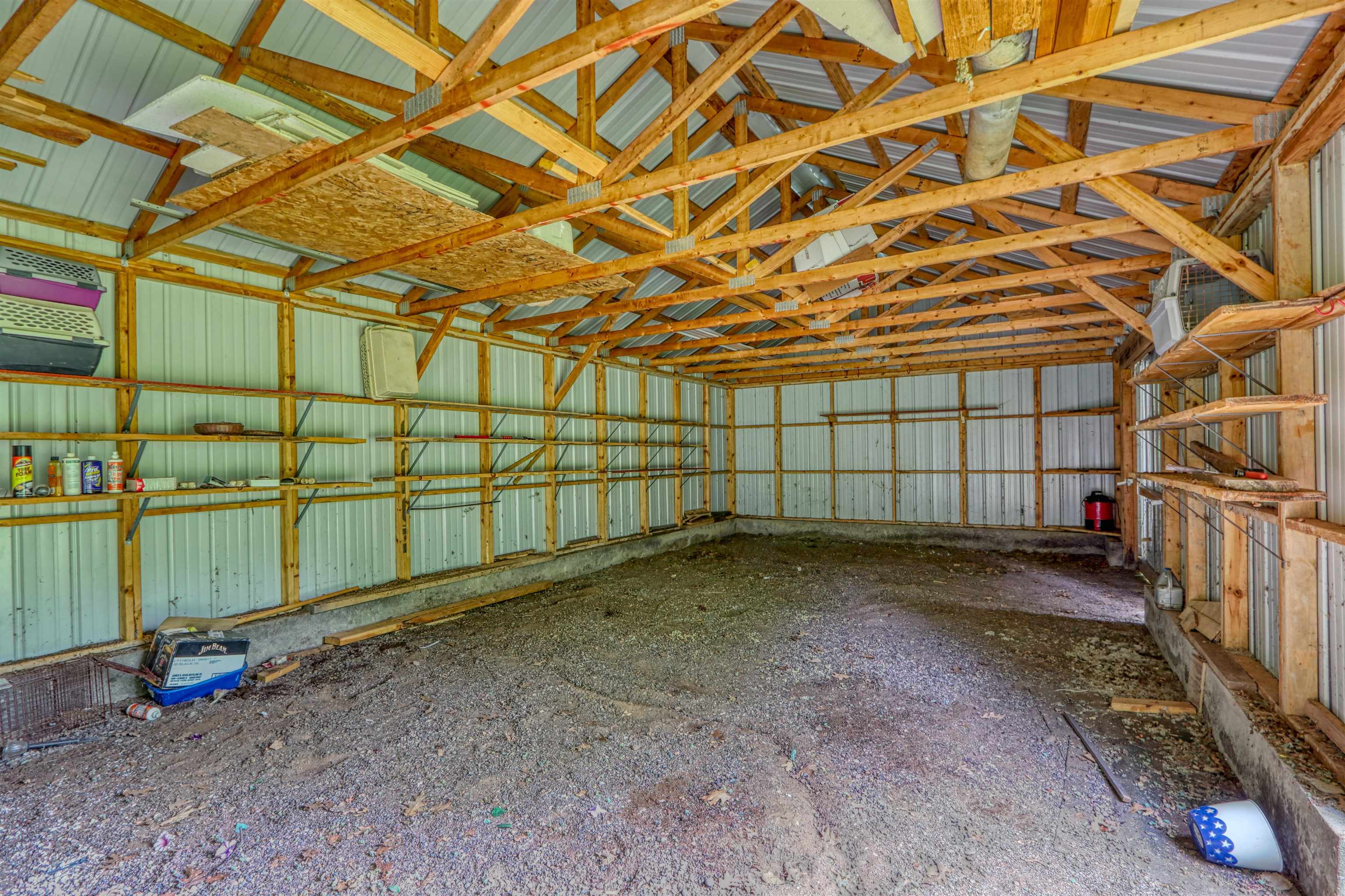 22655 Sunset Acres Lane Grand View, WI 54839 - Photo 40 of 47 Misc room featuring metal wall and vaulted ceiling