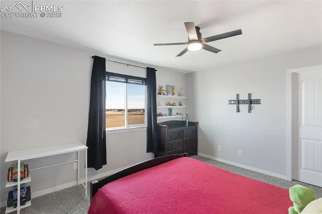 a bed room with a bed and a window