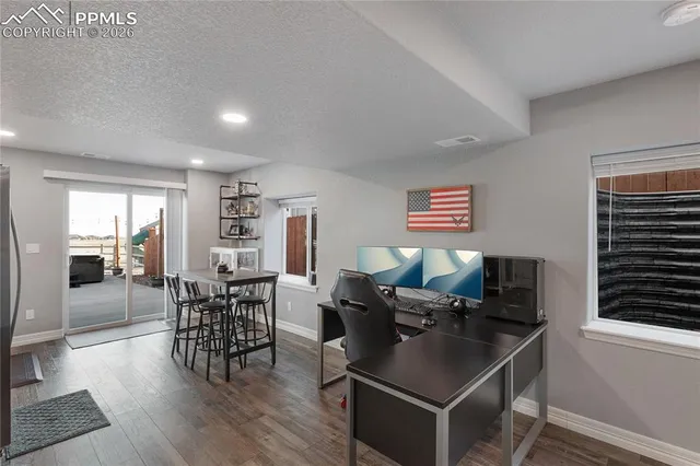 a living room with furniture a dining table and chairs