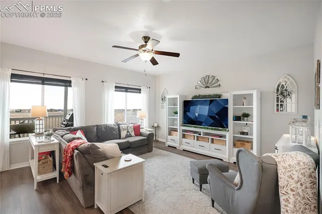 a living room with furniture and a flat screen tv