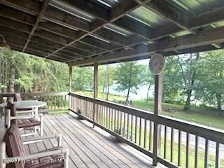 1171 Heart Lake Road Montrose, PA 18801 - Photo 14 of 57 a view of a chairs and tables in the balcony