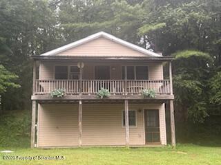 1171 Heart Lake Road Montrose, PA 18801 - Photo 2 of 57 a front view of a house with garage