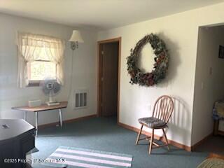 1171 Heart Lake Road Montrose, PA 18801 - Photo 30 of 56 a chair and a table in a room