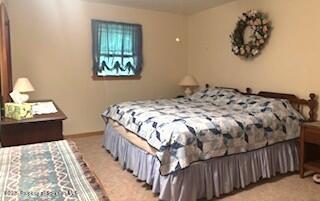 1171 Heart Lake Road Montrose, PA 18801 - Photo 52 of 57 a bedroom with a bed and a window