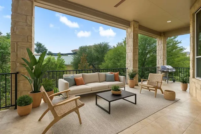 a dining room with furniture a chandelier and wooden floor