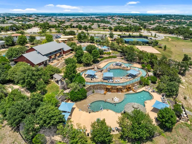 an aerial view of a house with lake view