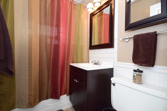 1219 Good Avenue Park Ridge, IL 60068 - Photo 12 of 25 a bathroom with a sink vanity and a mirror