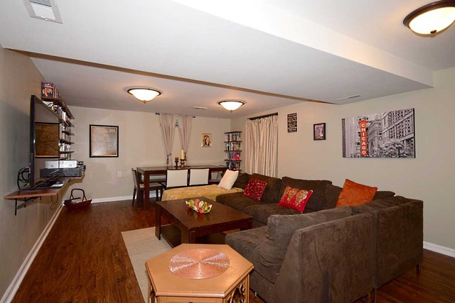1219 Good Avenue Park Ridge, IL 60068 - Photo 13 of 25 a living room with furniture kitchen view and a wooden floor