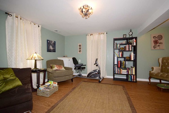 1219 Good Avenue Park Ridge, IL 60068 - Photo 14 of 25 a living room with furniture and a couch