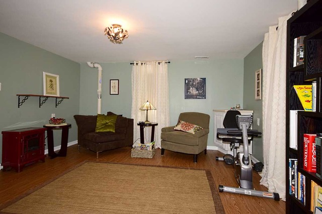1219 Good Avenue Park Ridge, IL 60068 - Photo 16 of 25 a living room with furniture and a flat screen tv