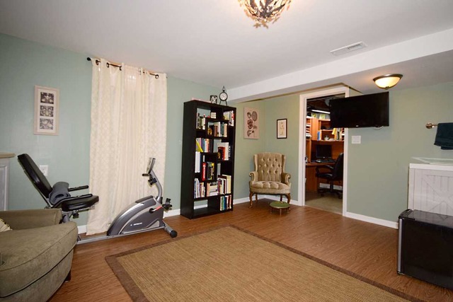 1219 Good Avenue Park Ridge, IL 60068 - Photo 18 of 25 a view of a livingroom with furniture and a flat screen tv