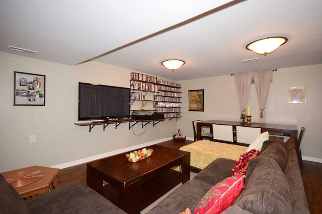 1219 Good Avenue Park Ridge, IL 60068 - Photo 20 of 25 a living room with furniture and a flat screen tv