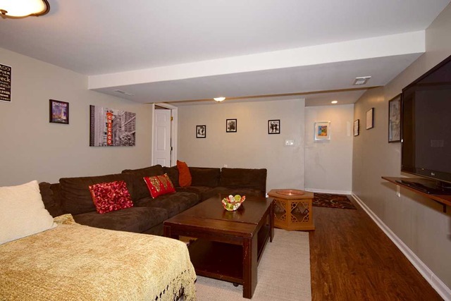 1219 Good Avenue Park Ridge, IL 60068 - Photo 21 of 25 a living room with furniture and a flat screen tv