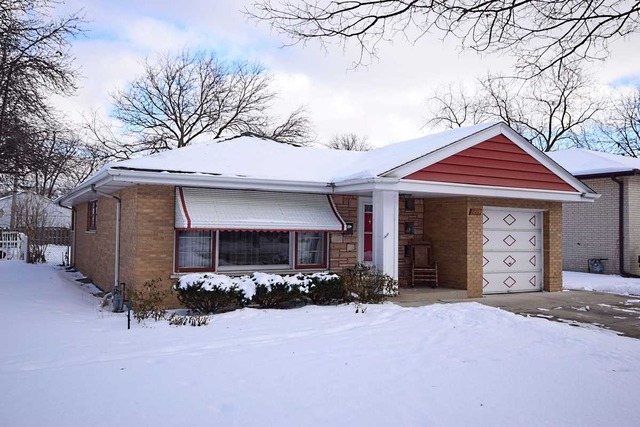 1219 Good Avenue Park Ridge, IL 60068 - Photo 22 of 25 a front view of a house with yard outdoor seating and barbeque oven