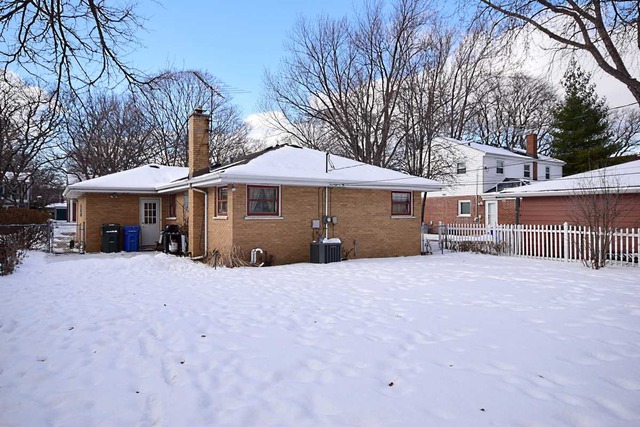 1219 Good Avenue Park Ridge, IL 60068 - Photo 23 of 25 a front view of a house with yard and trees