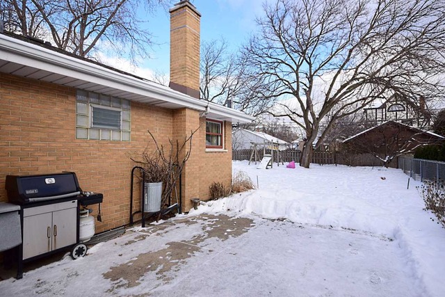1219 Good Avenue Park Ridge, IL 60068 - Photo 25 of 25 a view of a house with a snow in the yard