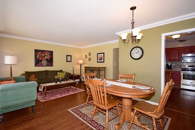 1219 Good Avenue Park Ridge, IL 60068 - Photo 7 of 25 a living room with furniture and a table