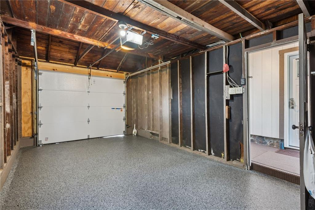 13379 Ridge Road Irwin, PA 15642 - Photo 36 of 38 ATTACHED GARAGE W/STORAGE ABOVE AND POLYASPARTIC COATING.