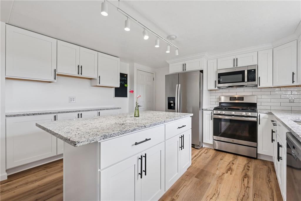 13379 Ridge Road Irwin, PA 15642 - Photo 5 of 38 NEW WHITE KITCHEN W/LARGE ISLAND.