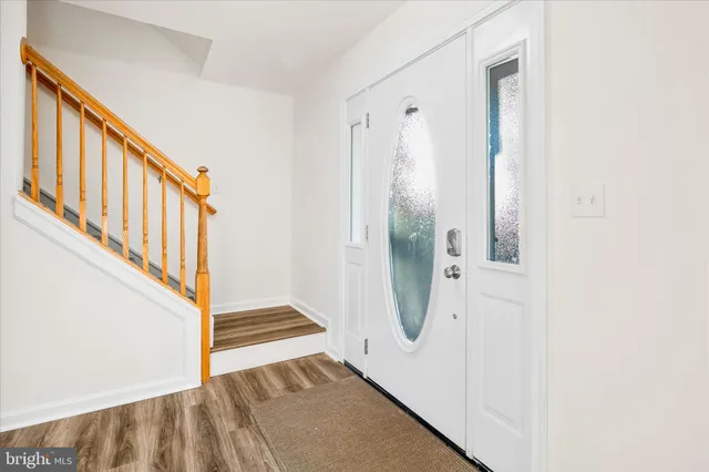a bathroom with a sink mirror vanity and toilet