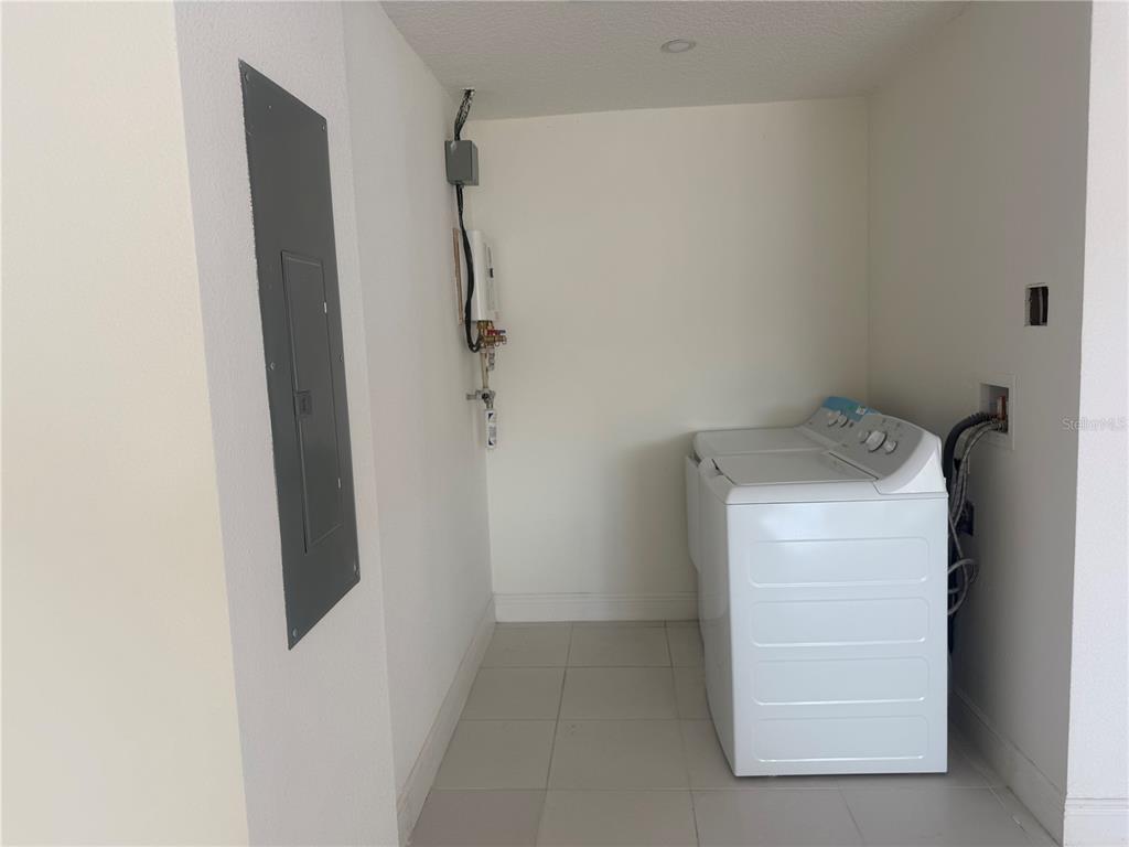 3444 Packard Avenue St. Cloud, FL 34772 - Photo 11 of 28 a utility room with dryer and washer