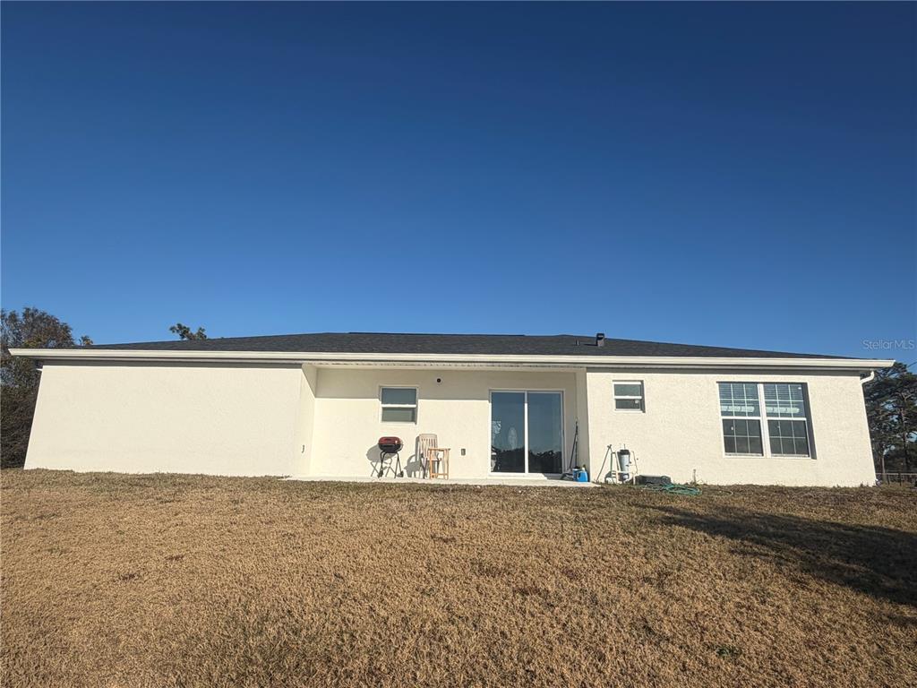 3444 Packard Avenue St. Cloud, FL 34772 - Photo 5 of 28 a view of a back yard of the house