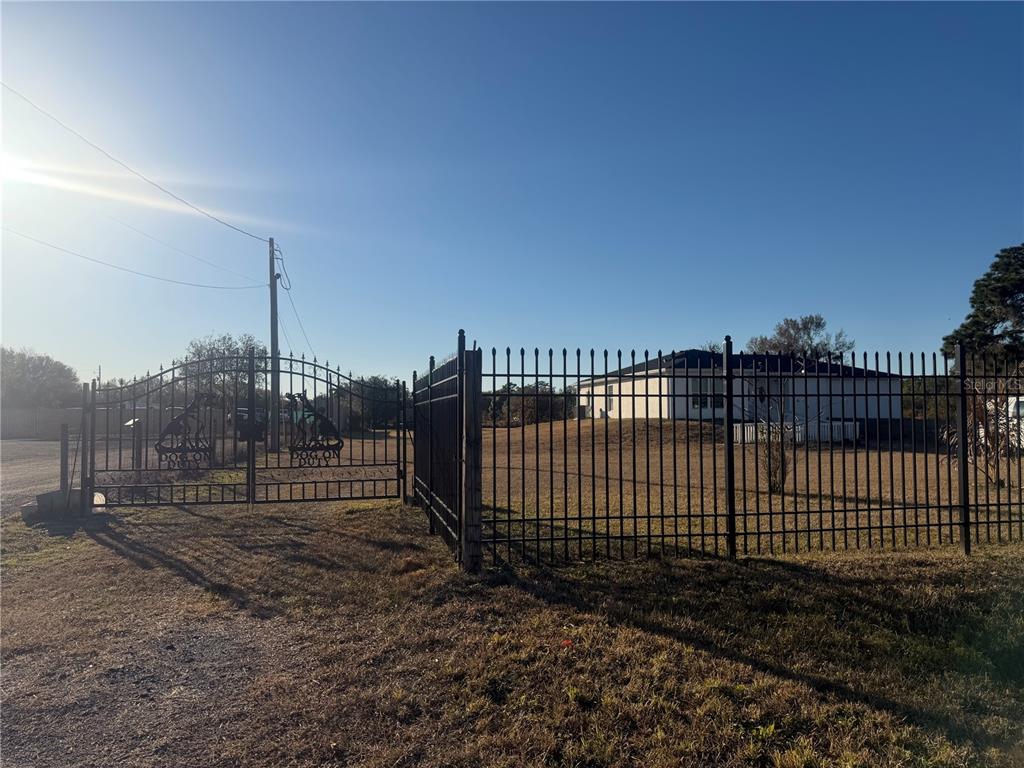3444 Packard Avenue St. Cloud, FL 34772 - Photo 8 of 28 a view of a backyard with iron fence