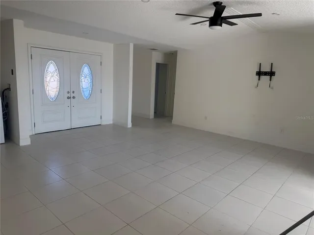 a kitchen with stainless steel appliances granite countertop a sink and a refrigerator