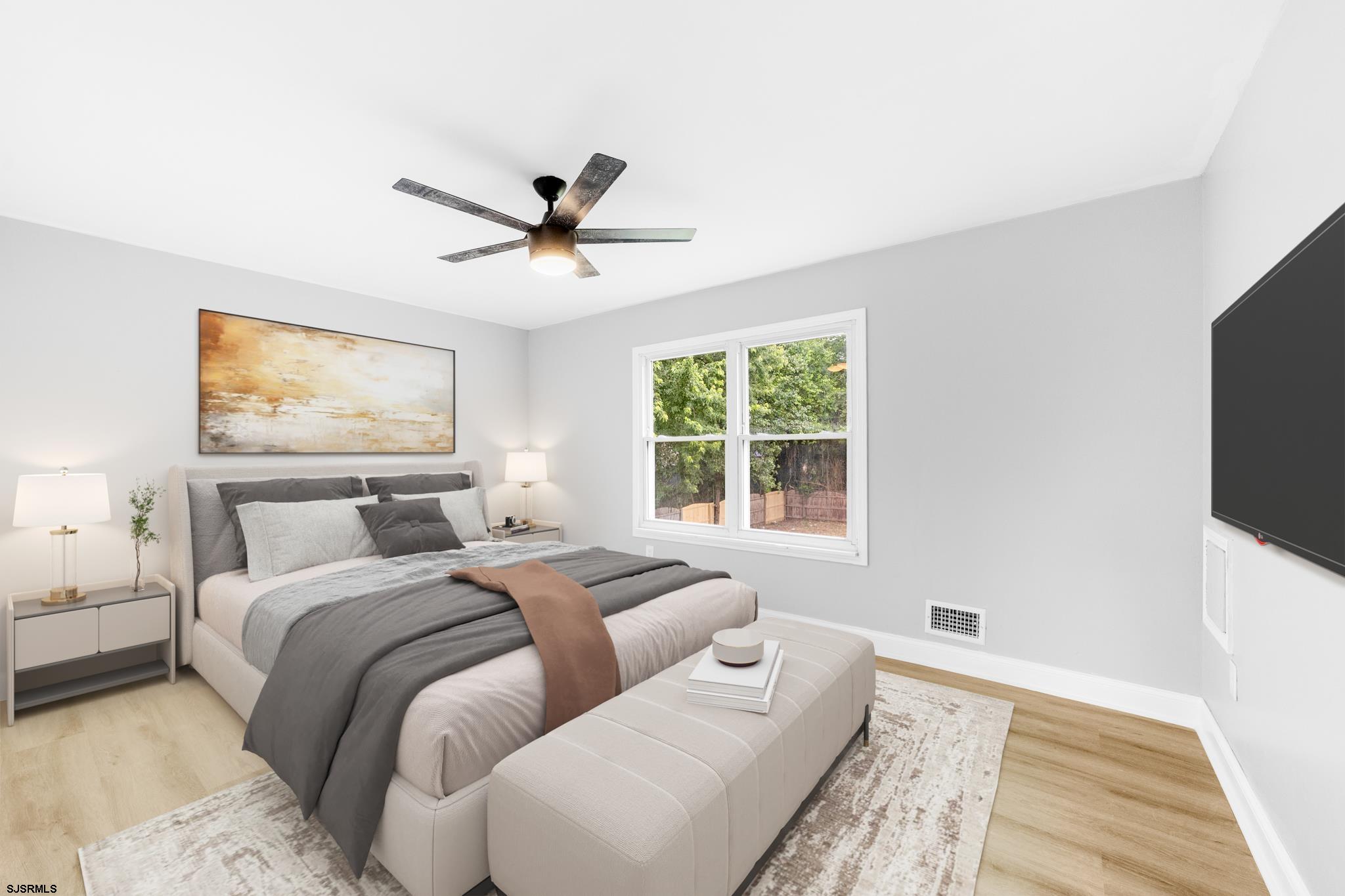 243 Wintergreen Lane Penns Grove, NJ 08069 - Photo 15 of 32 a bedroom with a large bed and a flat screen tv