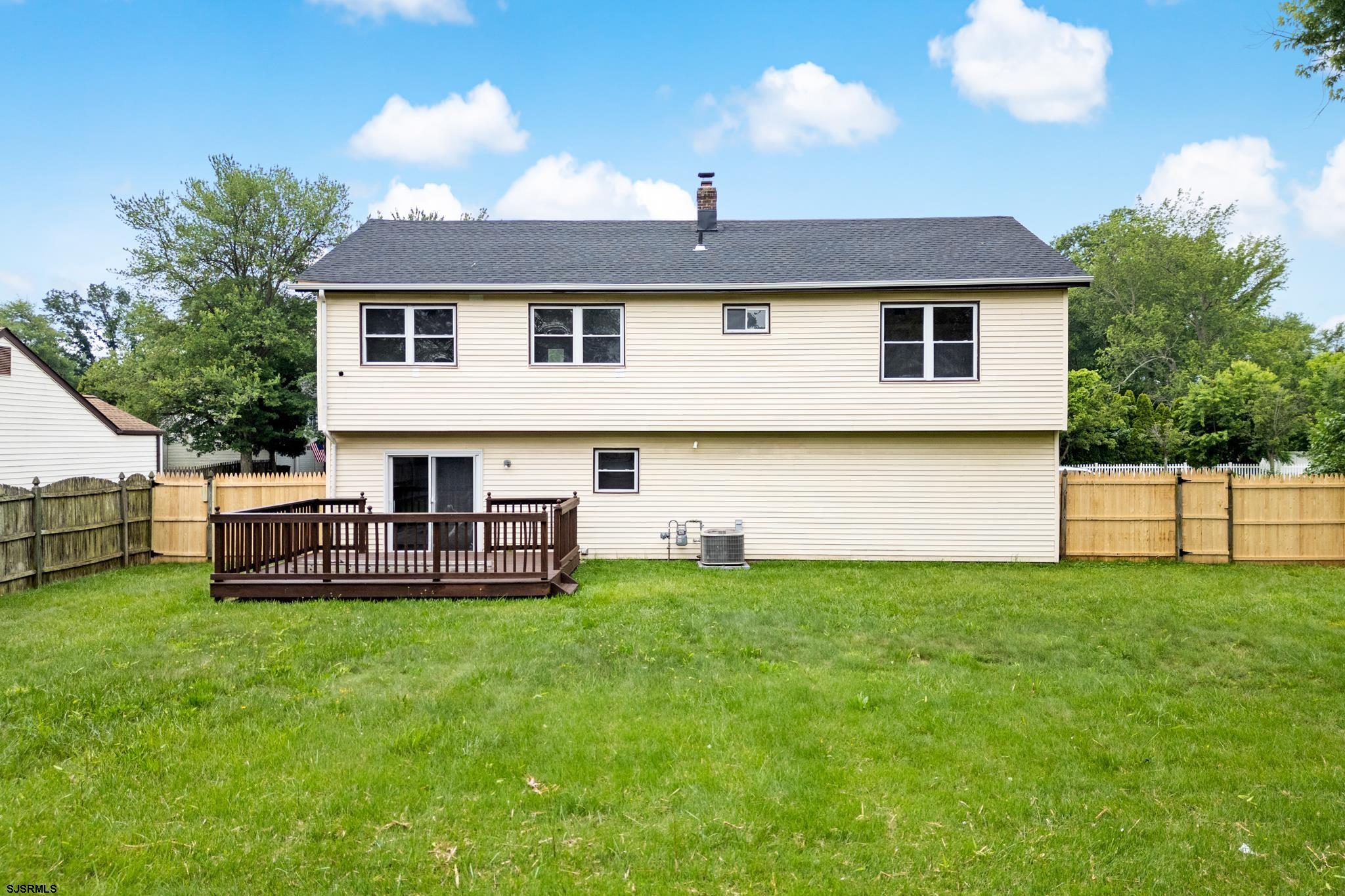 243 Wintergreen Lane Penns Grove, NJ 08069 - Photo 2 of 32 a view of a house with a yard and sitting area