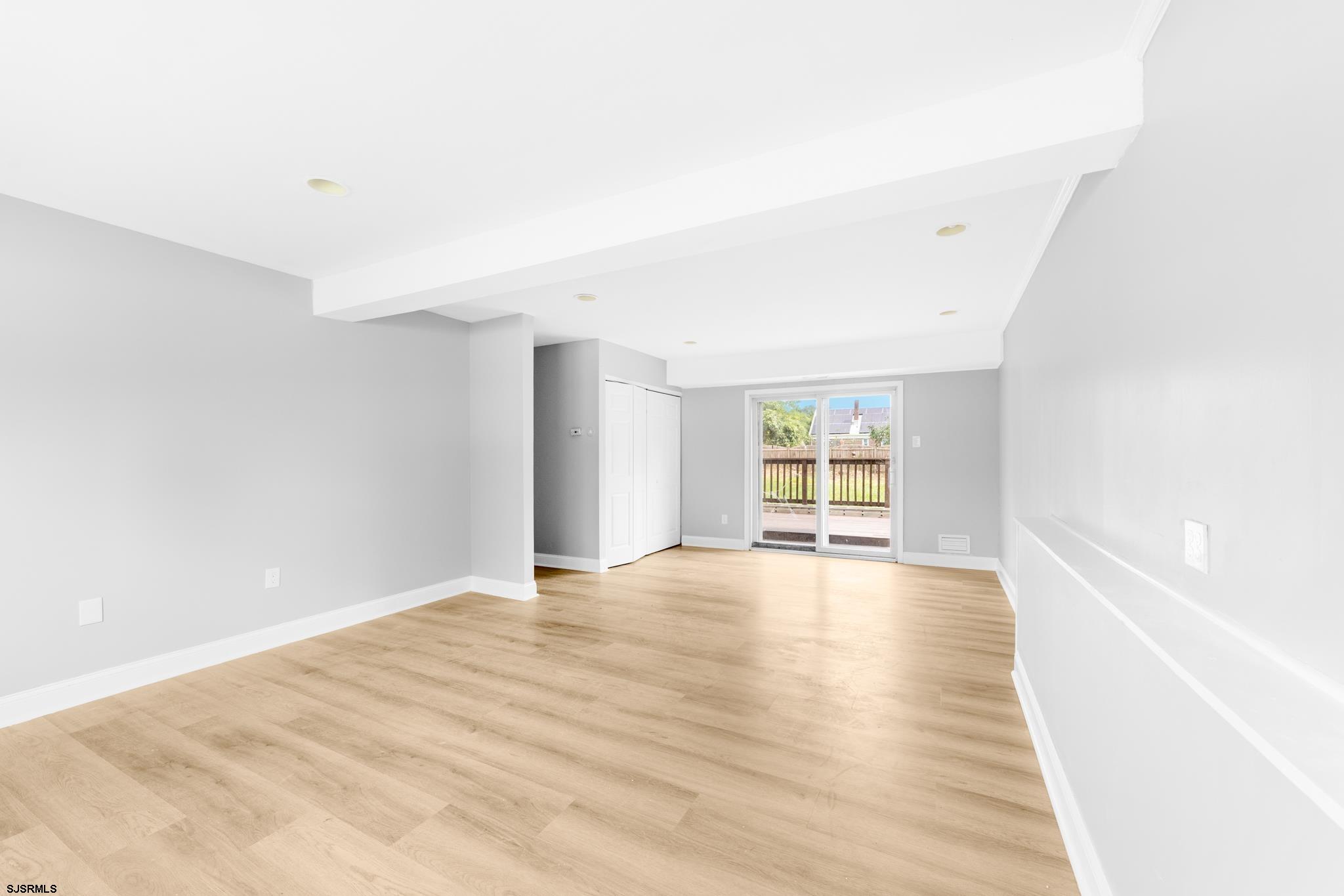 243 Wintergreen Lane Penns Grove, NJ 08069 - Photo 23 of 32 a view of an empty room with wooden floor and a window