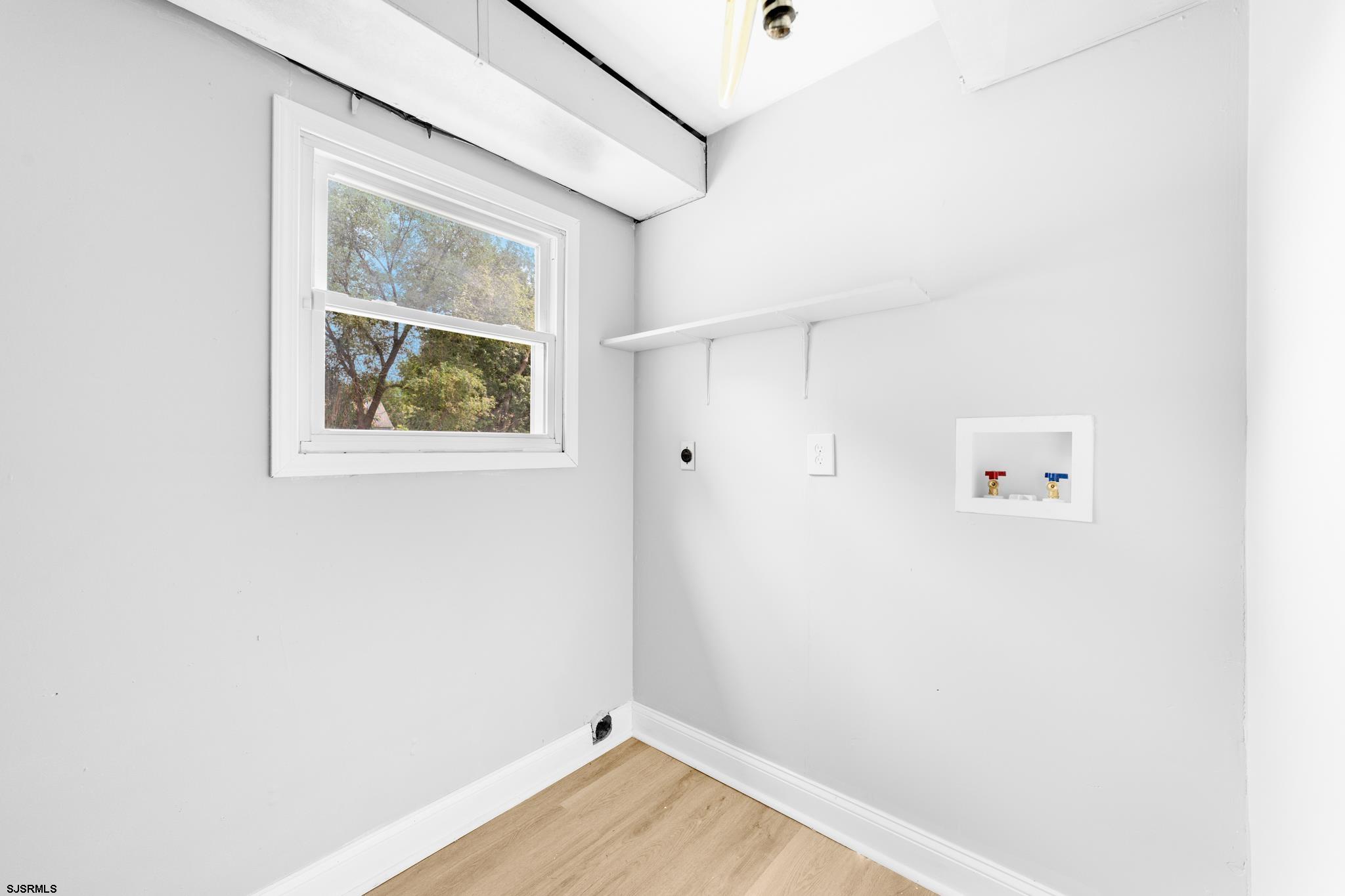 243 Wintergreen Lane Penns Grove, NJ 08069 - Photo 24 of 32 a view of room with window and wooden floor