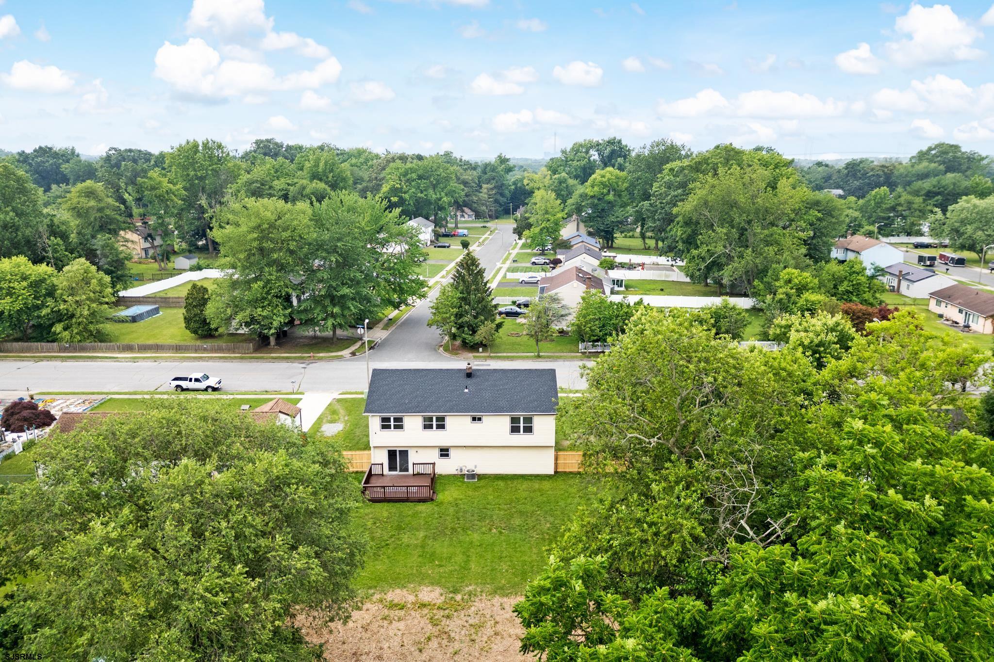 243 Wintergreen Lane Penns Grove, NJ 08069 - Photo 30 of 32 a view of a house with a yard