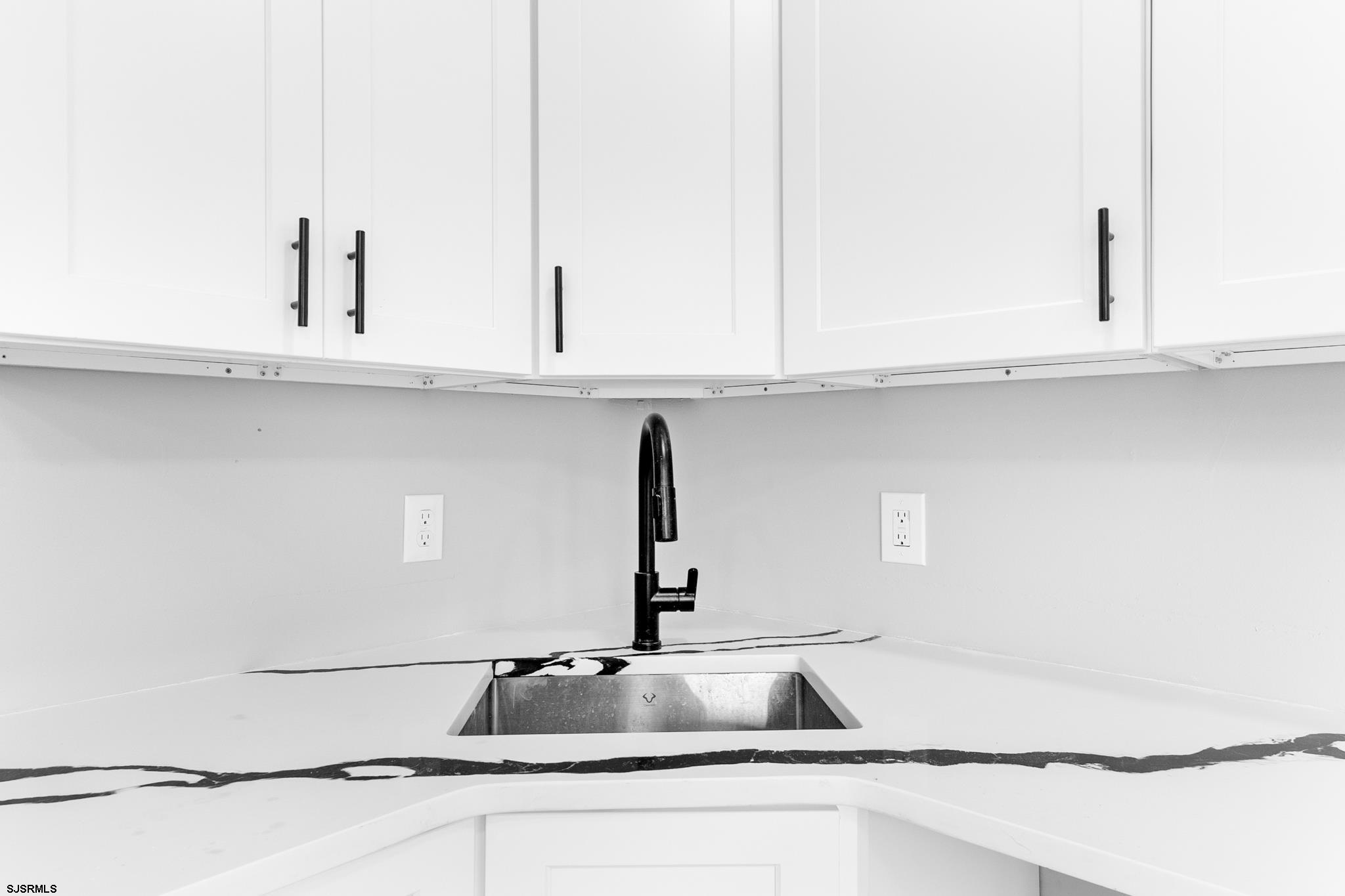 243 Wintergreen Lane Penns Grove, NJ 08069 - Photo 10 of 32 a kitchen with granite countertop white cabinets and a sink