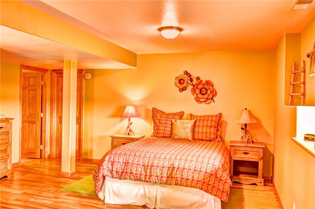 108 Australian Road Como, CO 80456 - Photo 11 of 25 a bedroom with a bed and a night stand