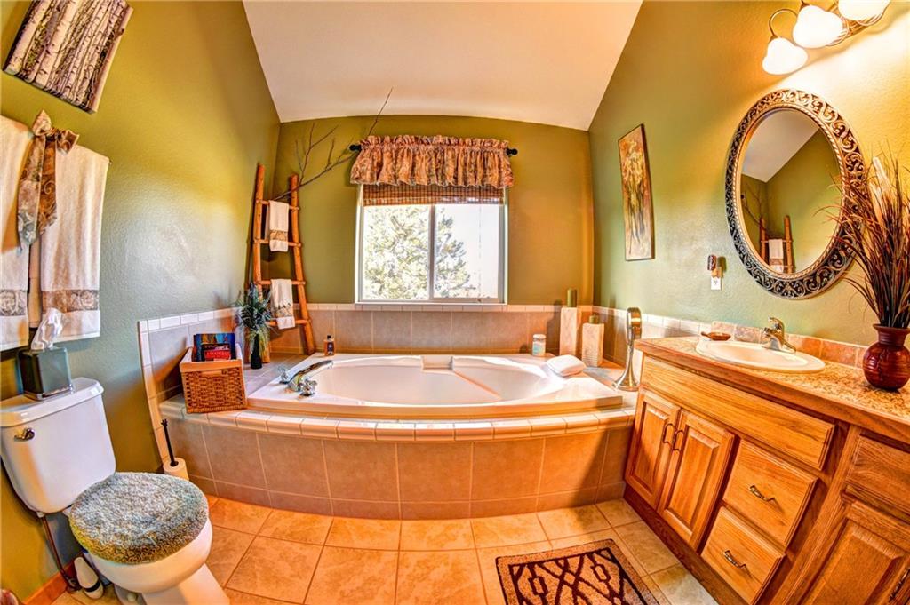 108 Australian Road Como, CO 80456 - Photo 14 of 25 a bathroom with a sink and a mirror