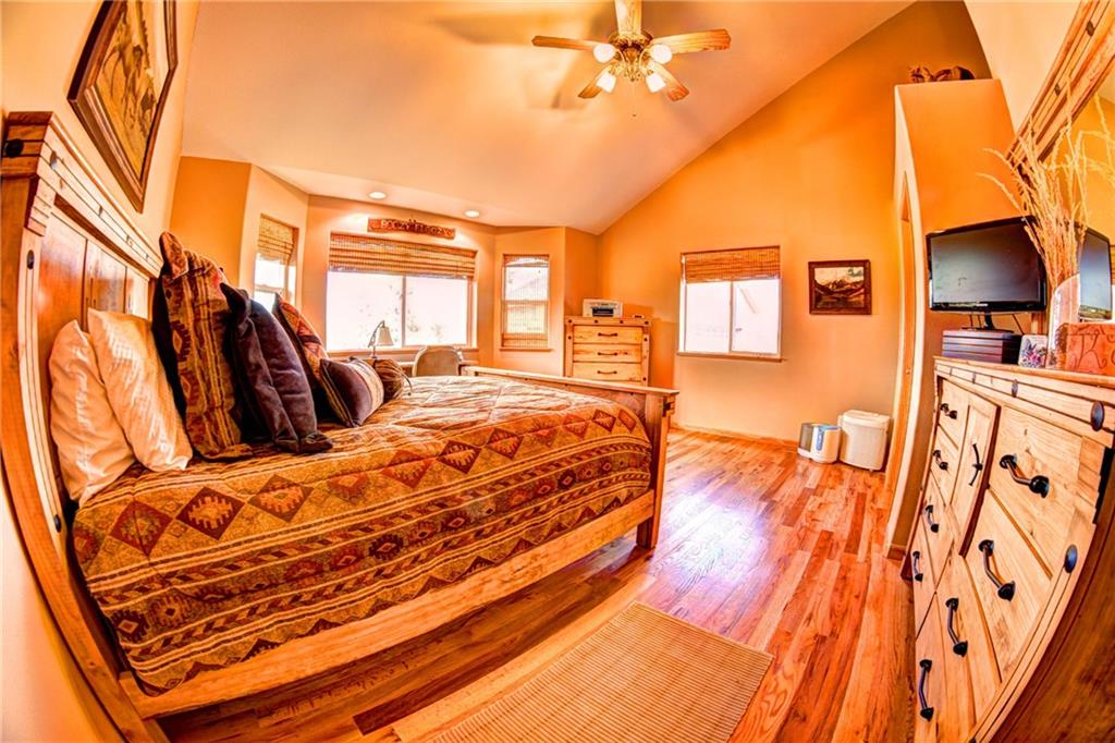 108 Australian Road Como, CO 80456 - Photo 15 of 25 a bedroom with a bed and a walk in closet