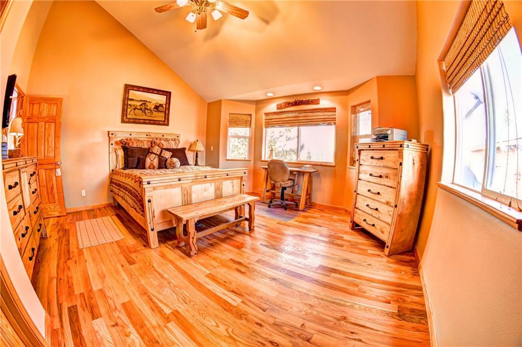 108 Australian Road Como, CO 80456 - Photo 16 of 25 a bedroom with furniture and a large window