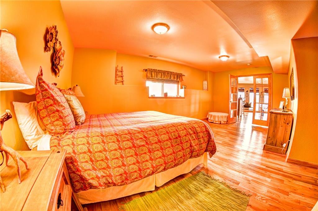 108 Australian Road Como, CO 80456 - Photo 19 of 25 a bedroom with a bed and a night stand