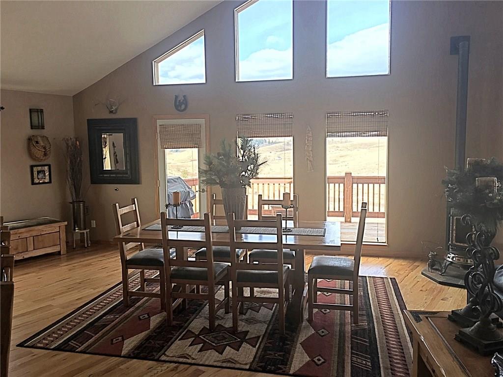 108 Australian Road Como, CO 80456 - Photo 8 of 25 a view of a dining room with furniture window and wooden floor