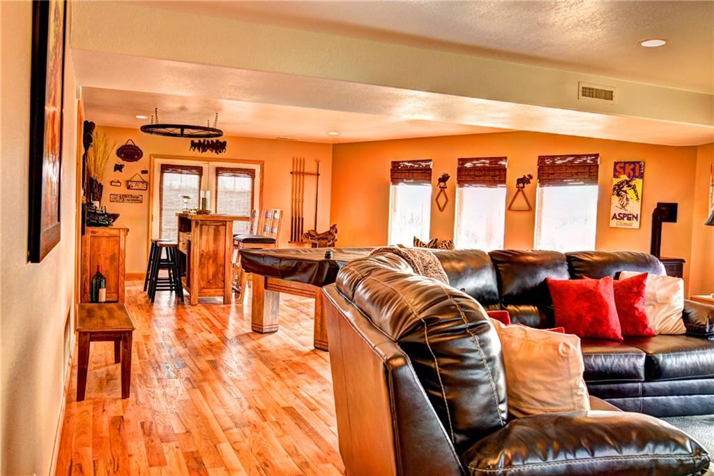 108 Australian Road Como, CO 80456 - Photo 10 of 25 a living room with furniture and large windows