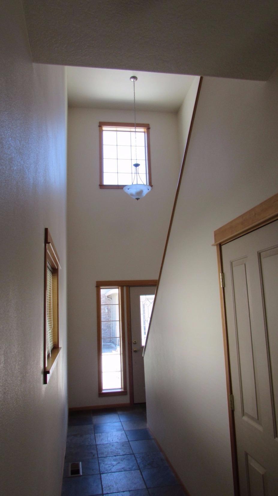 608 Shadow Way Central Point, OR 97502 - Photo 17 of 33 wooden floor in an empty room with a window