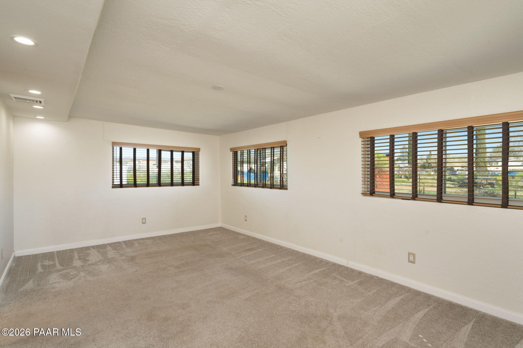 17270 East Peach Tree Road Mayer, AZ 86333 - Photo 11 of 31 a view of an empty room with a window