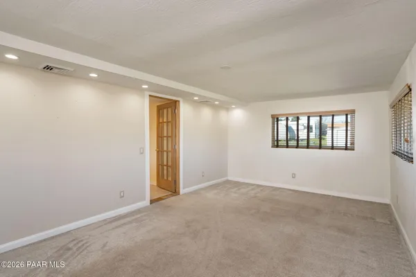 a view of an empty room with a window