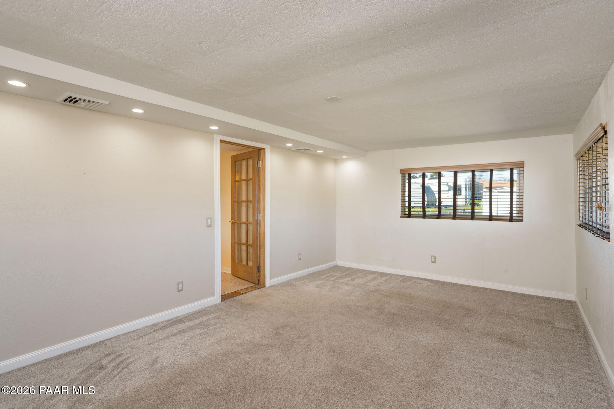 17270 East Peach Tree Road Mayer, AZ 86333 - Photo 12 of 31 a view of an empty room with a window