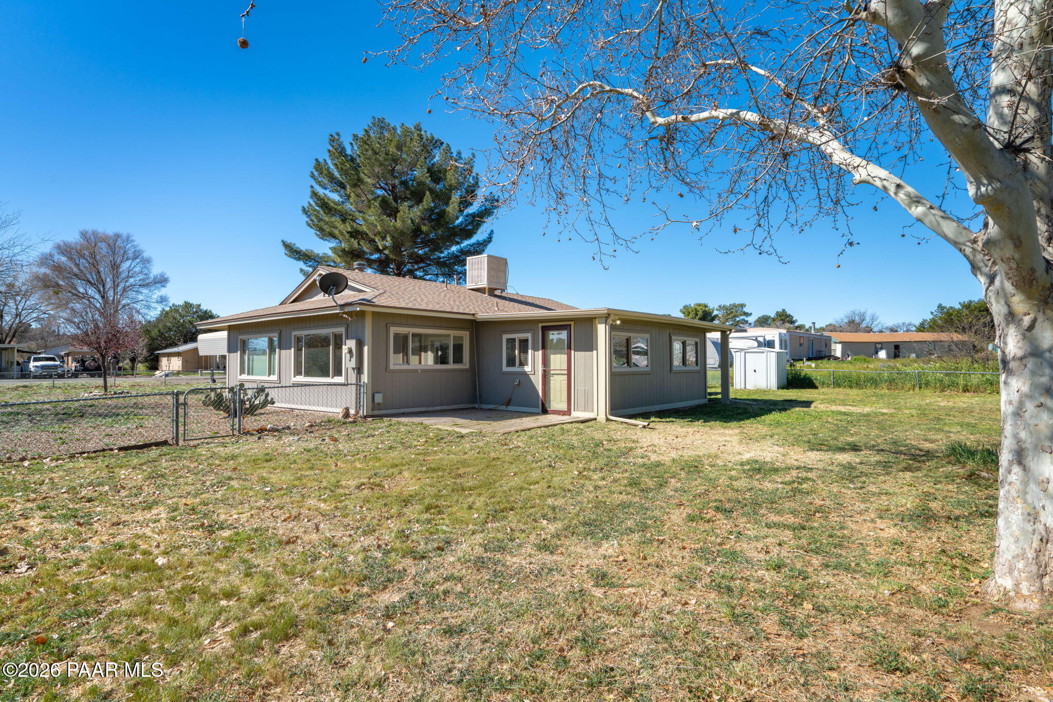 17270 East Peach Tree Road Mayer, AZ 86333 - Photo 2 of 31 a front view of a house with a yard