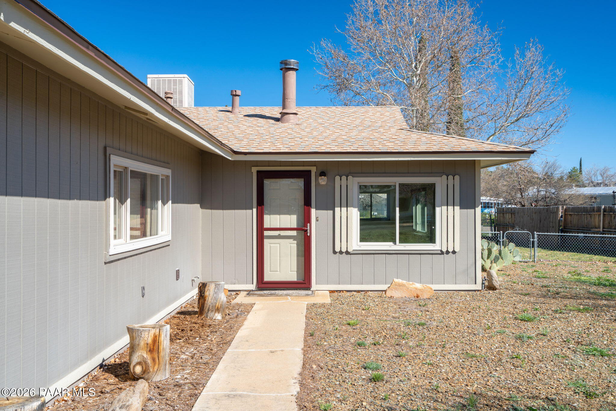 17270 East Peach Tree Road Mayer, AZ 86333 - Photo 23 of 31 a front view of a house with a garden