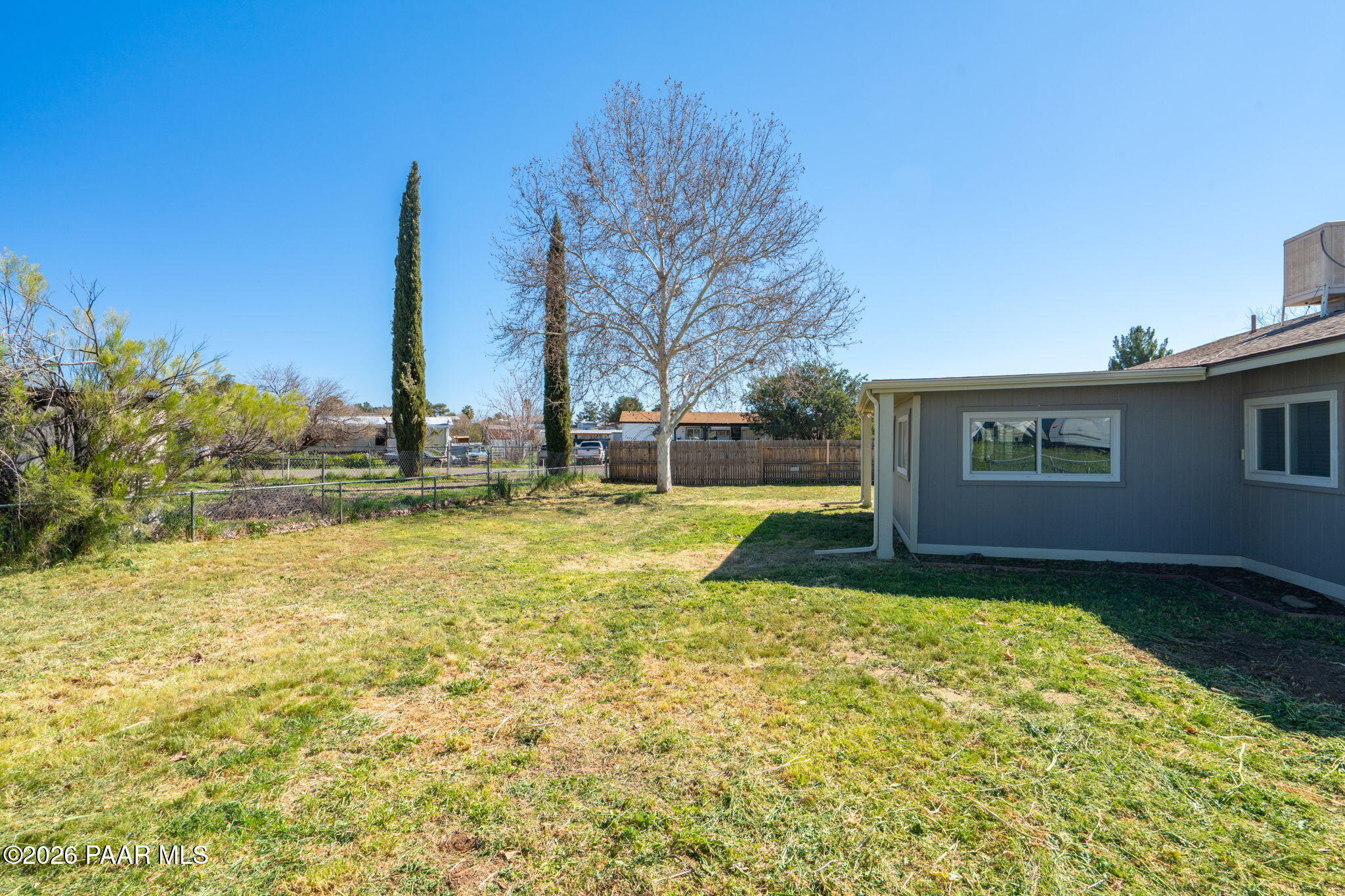 17270 East Peach Tree Road Mayer, AZ 86333 - Photo 24 of 31 a view of a house with a swimming pool