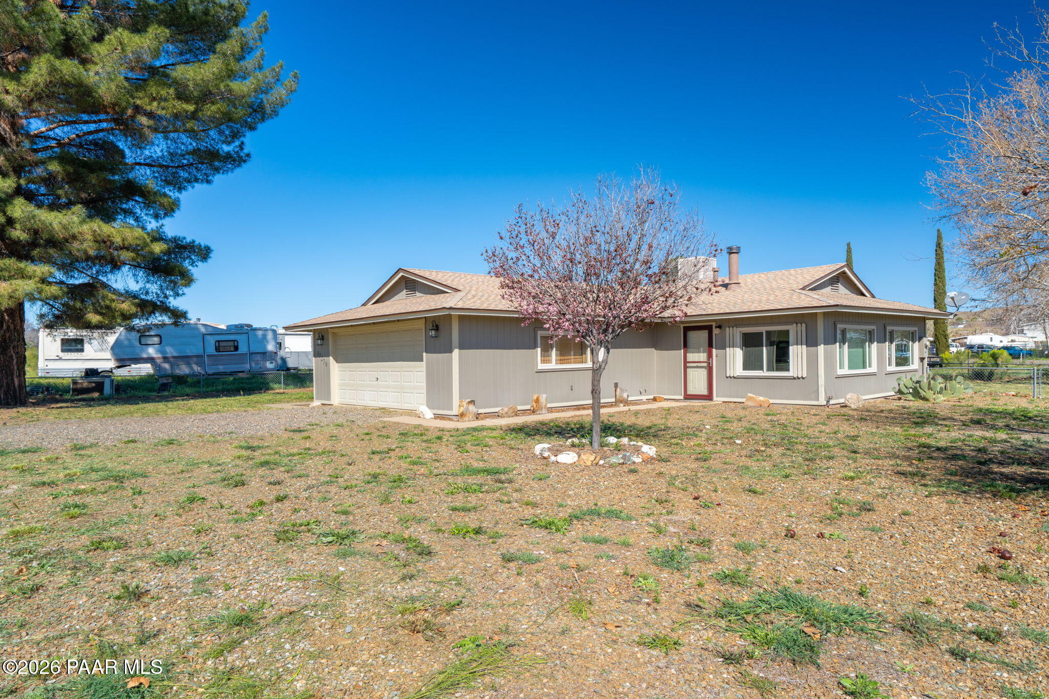 17270 East Peach Tree Road Mayer, AZ 86333 - Photo 25 of 31 a front view of a house with a yard
